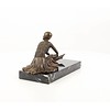 Bronze sculpture of an Art Deco sitting female dancer