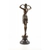 A bronze sculpture of a female Egyptian dancer