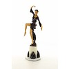 A large bronze sculpture of a graceful dancer with wooden inlay
