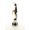 A large bronze sculpture of a graceful dancer with wooden inlay