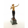 A bronze sculpture of a half nude female dancer with wooden inlay