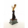 A bronze sculpture of a half nude female dancer with wooden inlay