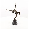 A bronze sculpture of a flame leaper