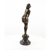 A large bronze sculpture of a pensive female