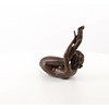 An erotic bronze sculpture of a nude female pleasing herself while lying down