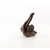 An erotic bronze sculpture of a nude female pleasing herself while lying down