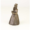 A bronze figural table bell of a gentleman