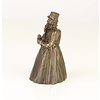 A bronze figural table bell of a gentleman