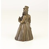 A bronze figural table bell of a gentleman