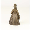 A bronze figural table bell of a gentleman