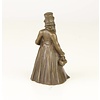 A bronze figural table bell of a gentleman