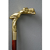 A wooden walking stick with bronze grip of intense female nude