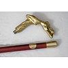 A wooden walking stick with bronze grip of intense female nude