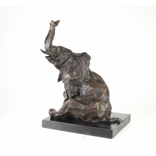  A  bronze sculpture of a sitting elephant