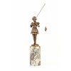 A bronze sculpture of a young girl fishing