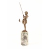 A bronze sculpture of a young girl fishing