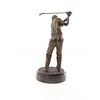 A bronze sculpture of a male golfer