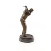 A bronze sculpture of a male golfer
