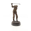 A bronze sculpture of a male golfer