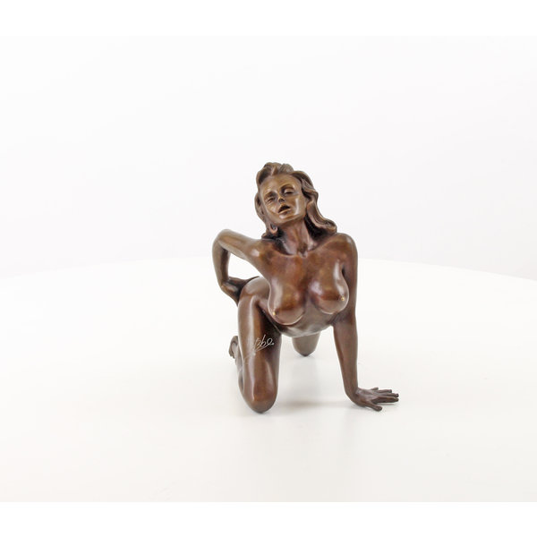  A bronze sculpture of a female nude crawling