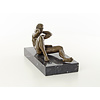 A bronze sculpture of a reclining male nude