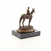 A bronze sculpture of a racehorse and jockey