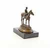 A bronze sculpture of a racehorse and jockey