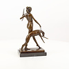 A bronze sculpture of the goddess Diana with hound