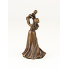 A bronze table bell of a female holding child