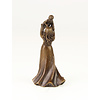 A bronze table bell of a female holding child