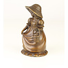 A bronze figural table bell of a young girl