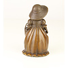 A bronze figural table bell of a young girl