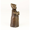 A bronze table bell of a drinking monk