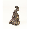 A bronze table bell of a lady with basket