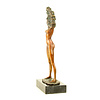 A bronze sculpture of an undressing female