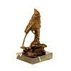 A bronze sculpture of a cardinal bird