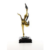 A bronze sculpture of a Modern art female nude