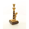 A pair of gilt bronze candlesticks with cherub