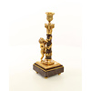 A pair of gilt bronze candlesticks with cherub