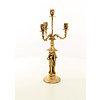 A four armed gilt bronze candelabra set