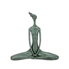 A Modernist bronze sculpture of a female nude in yoga pose