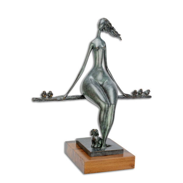  A bronze sculpture of a relaxing female nude