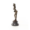 An erotic bronze sculpture of a standing female nude