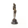 An erotic bronze sculpture of a standing female nude