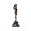 An erotic bronze sculpture of a standing female nude