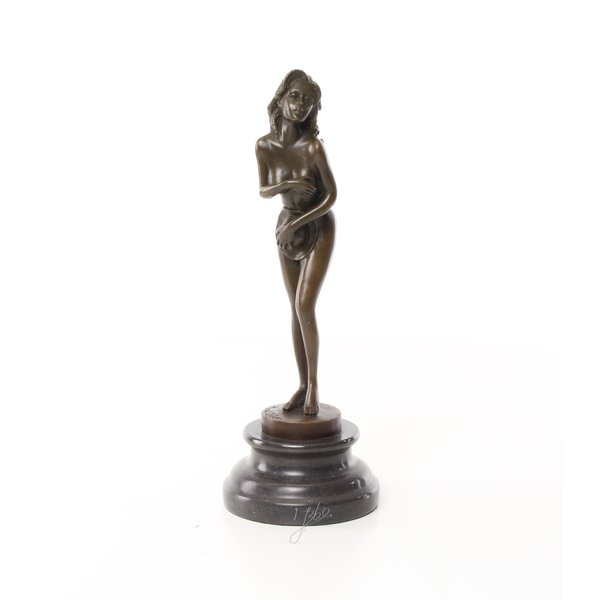  An erotic bronze sculpture of a standing female nude