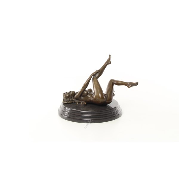  An erotic bronze sculpture of a reclining female nude