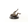 An erotic bronze sculpture of a reclining female nude