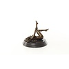 An erotic bronze sculpture of a reclining female nude