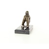 An erotic bronze sculpture of a kneeling nude female